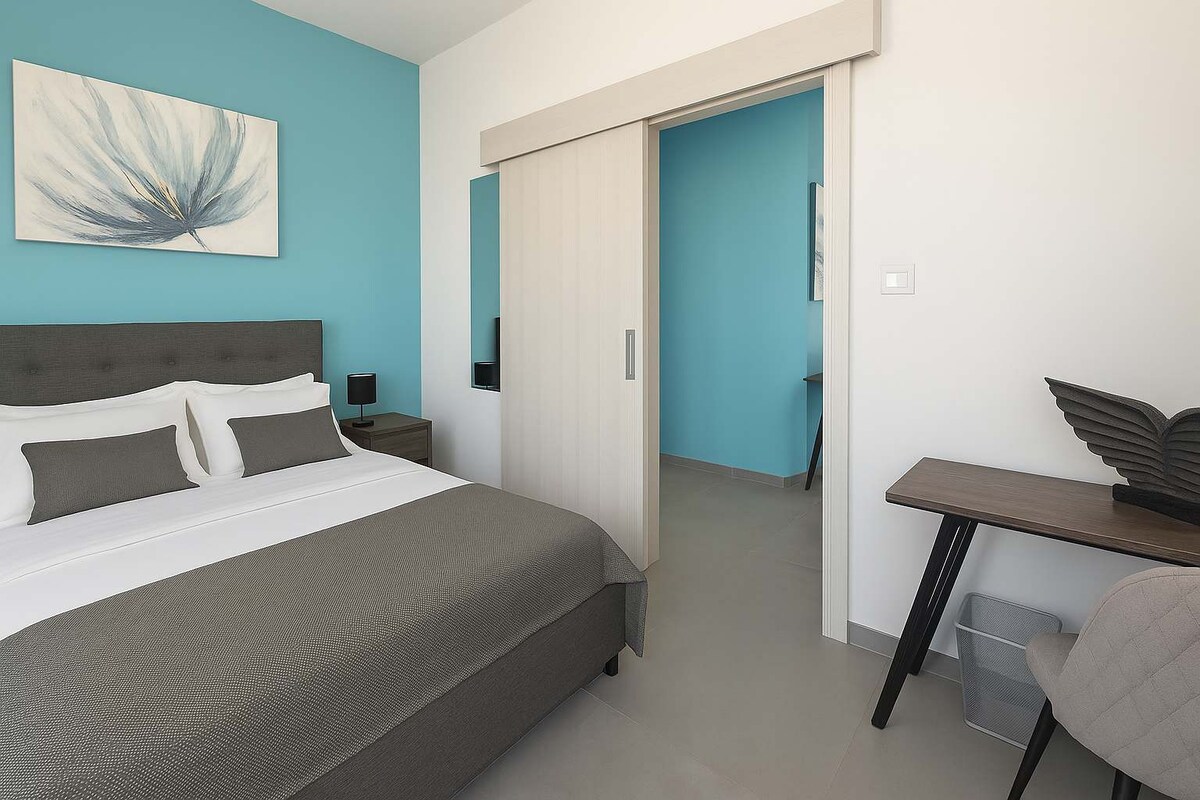 Bedroom of the Lux Skyline Suite